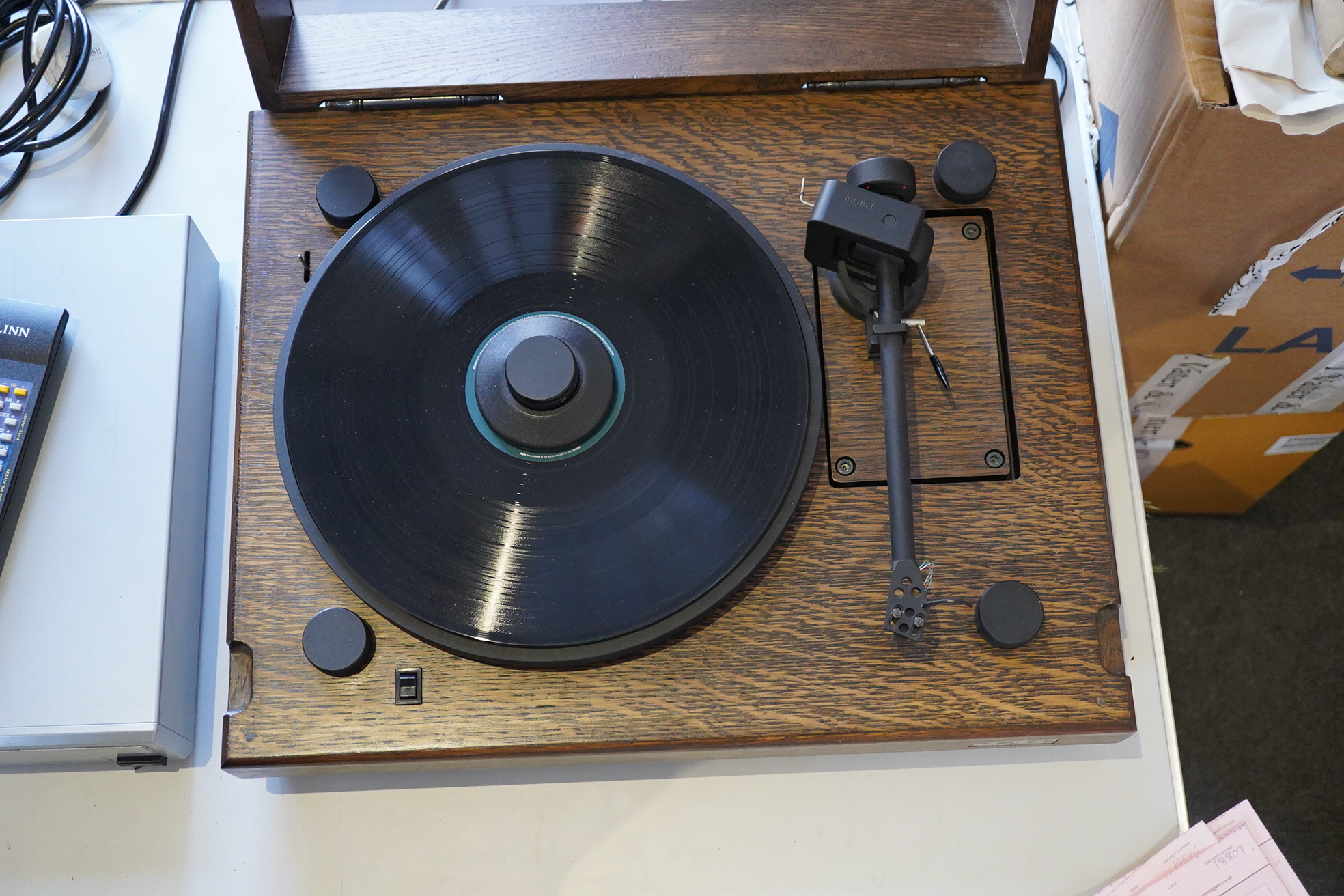 A Kuzma Stabi 2 HiFi turntable record player in a stained oak case